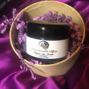 Natural hair growth cream by Lisa Johnson.